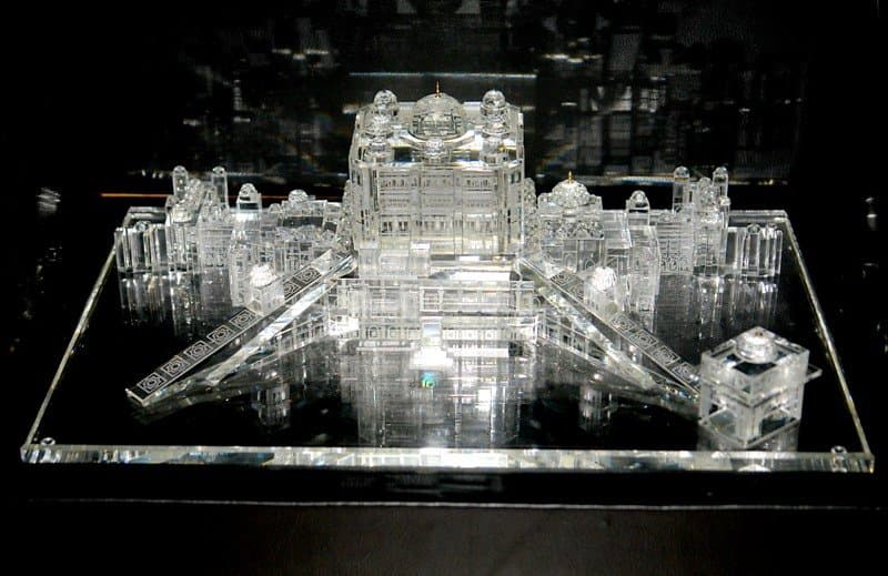 Broad clear palace miniature with a raised central section, repeated windows and symmetrical wings