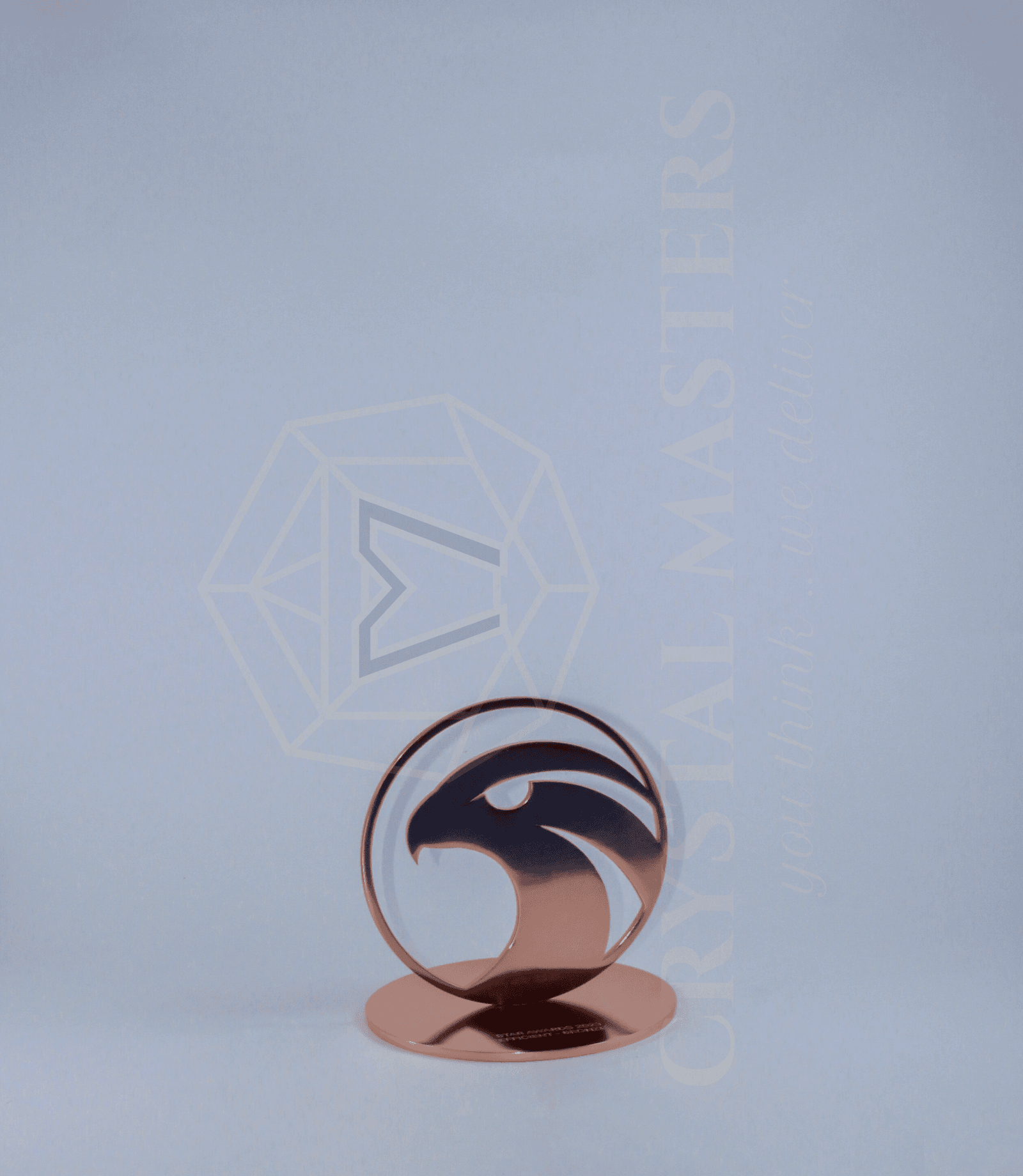 Circular award with a dark wave-like inner pattern and low rose-toned curved foot