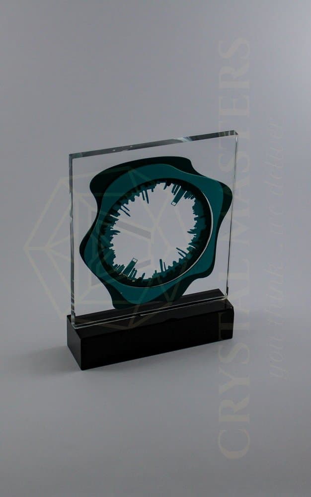 Pale radial centre inside a deep green ornamental frame on a dark rectangular base