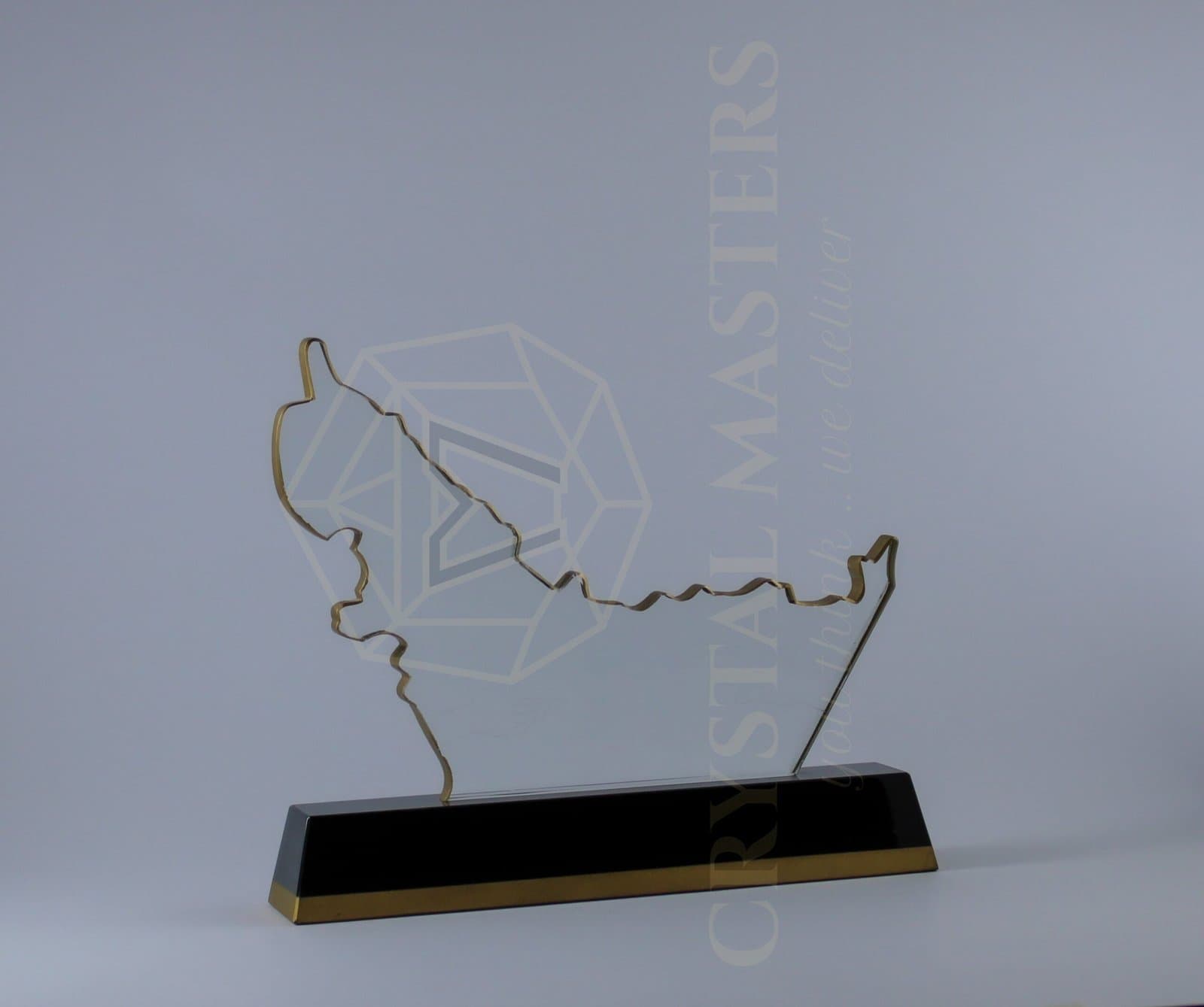 Thin open gold-toned UAE-map outline above a long black rectangular base