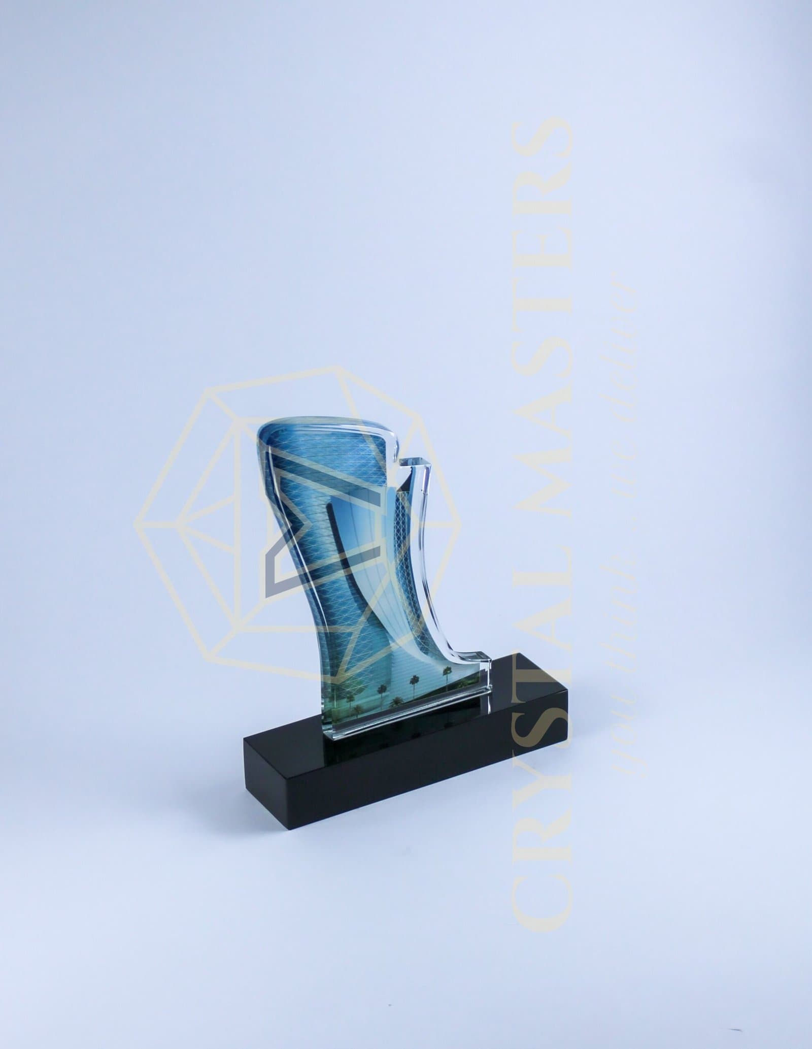 Blue-toned curved tower-shaped award with pale line details on a black rectangular base