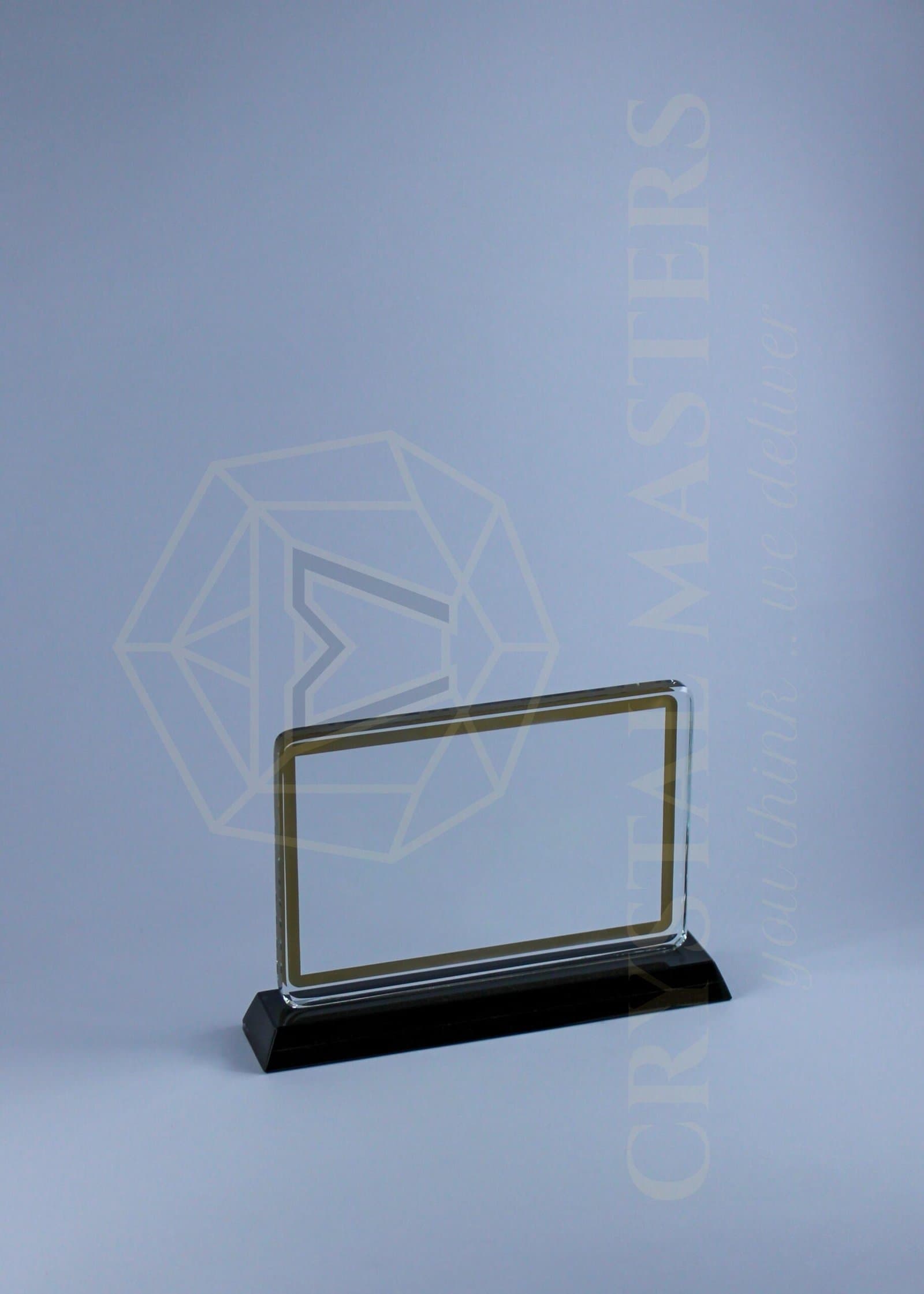Clear rectangular award with a thin gold-toned border on a low black base