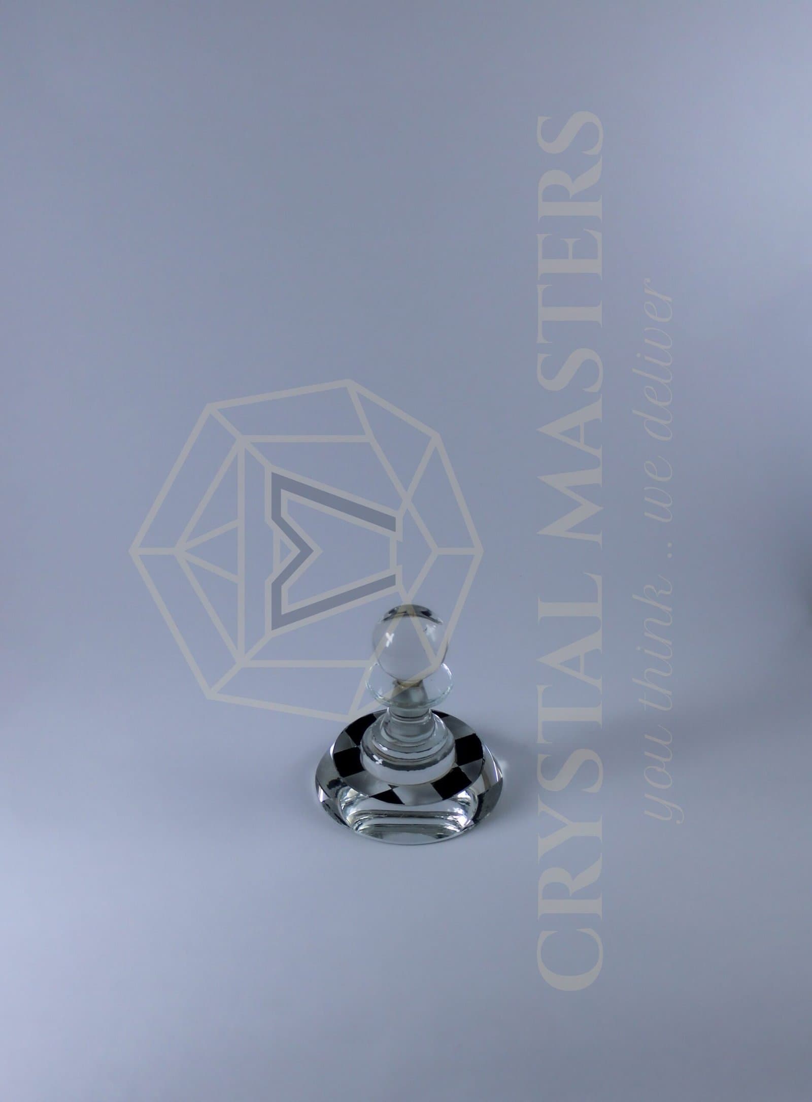 Clear rounded crystal keepsake on a shaped transparent pedestal