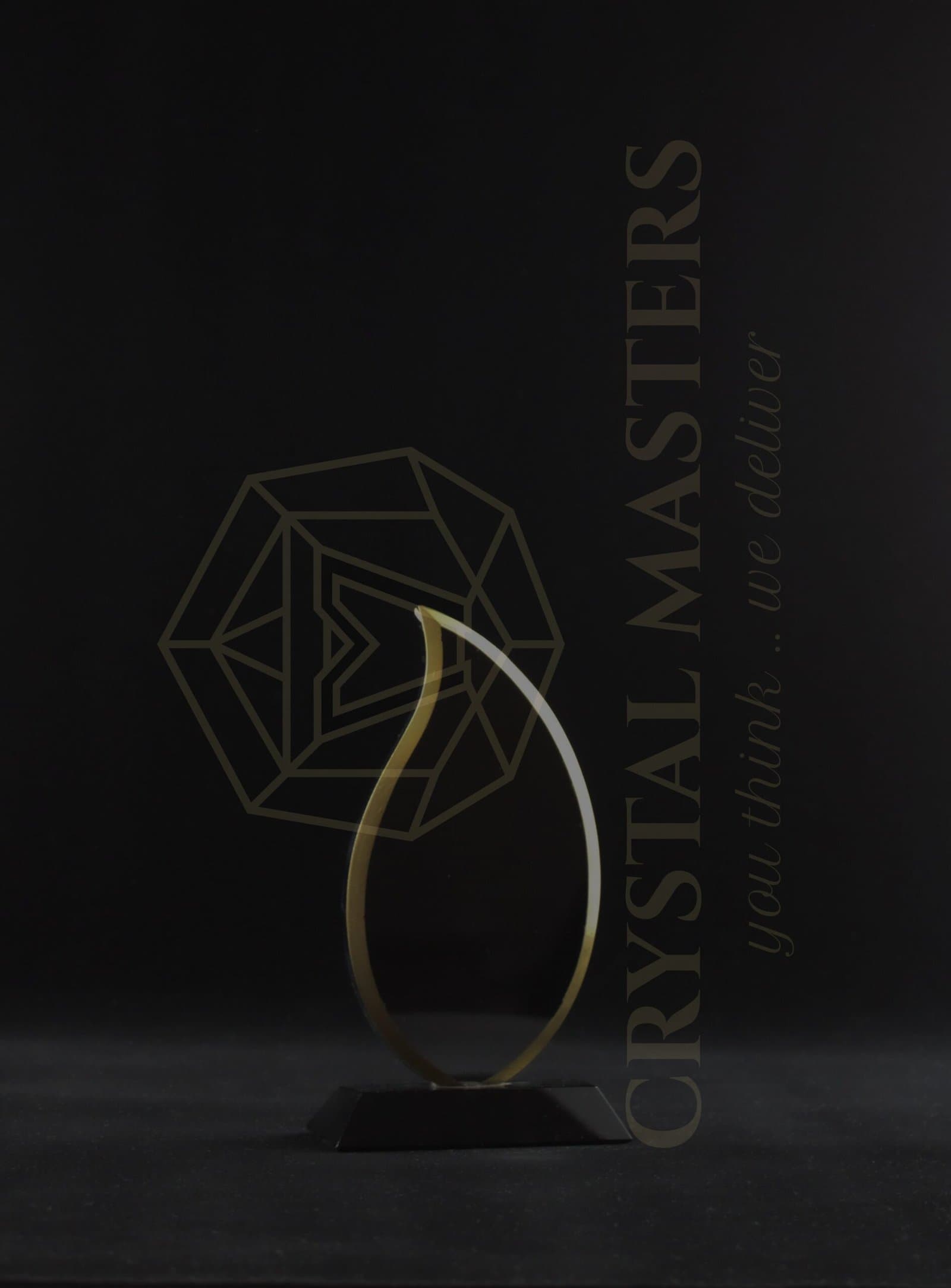 Thin gold-toned teardrop-shaped open award outline on a low dark foot