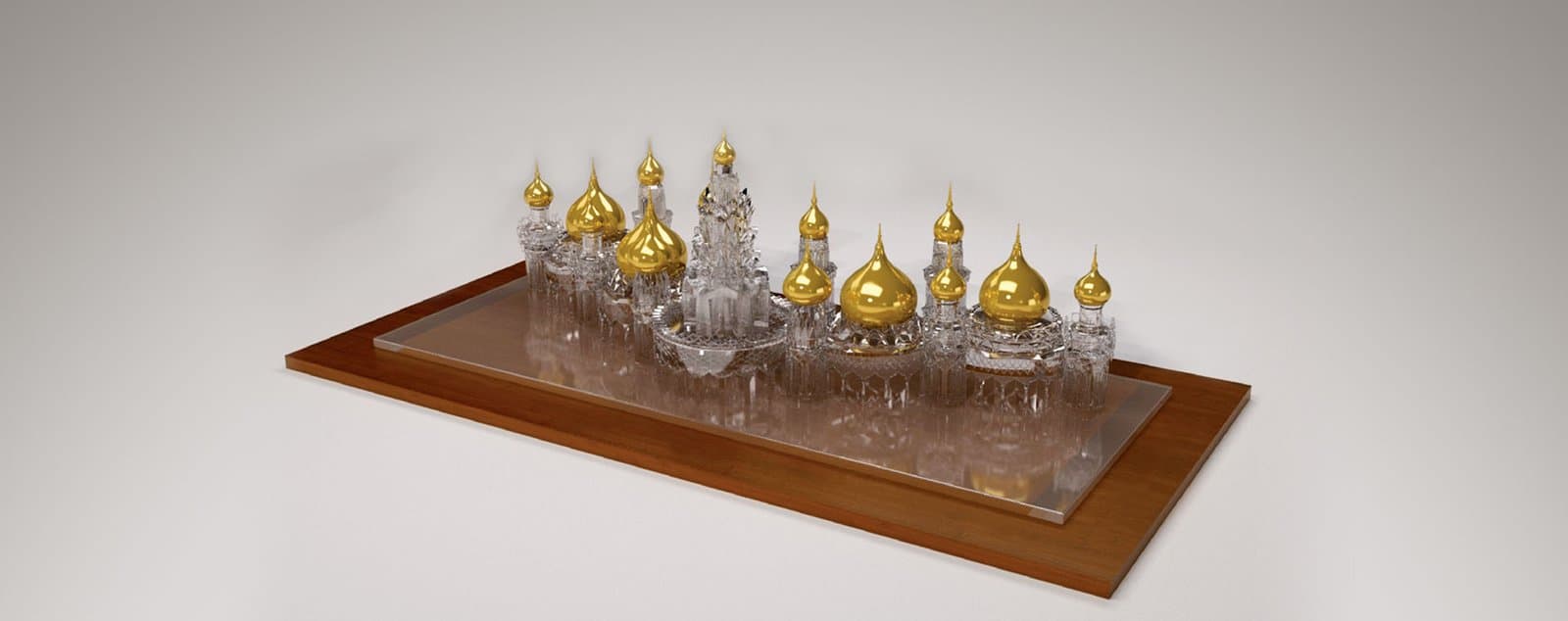 Crystal architectural model with gold domes on a wooden presentation base
